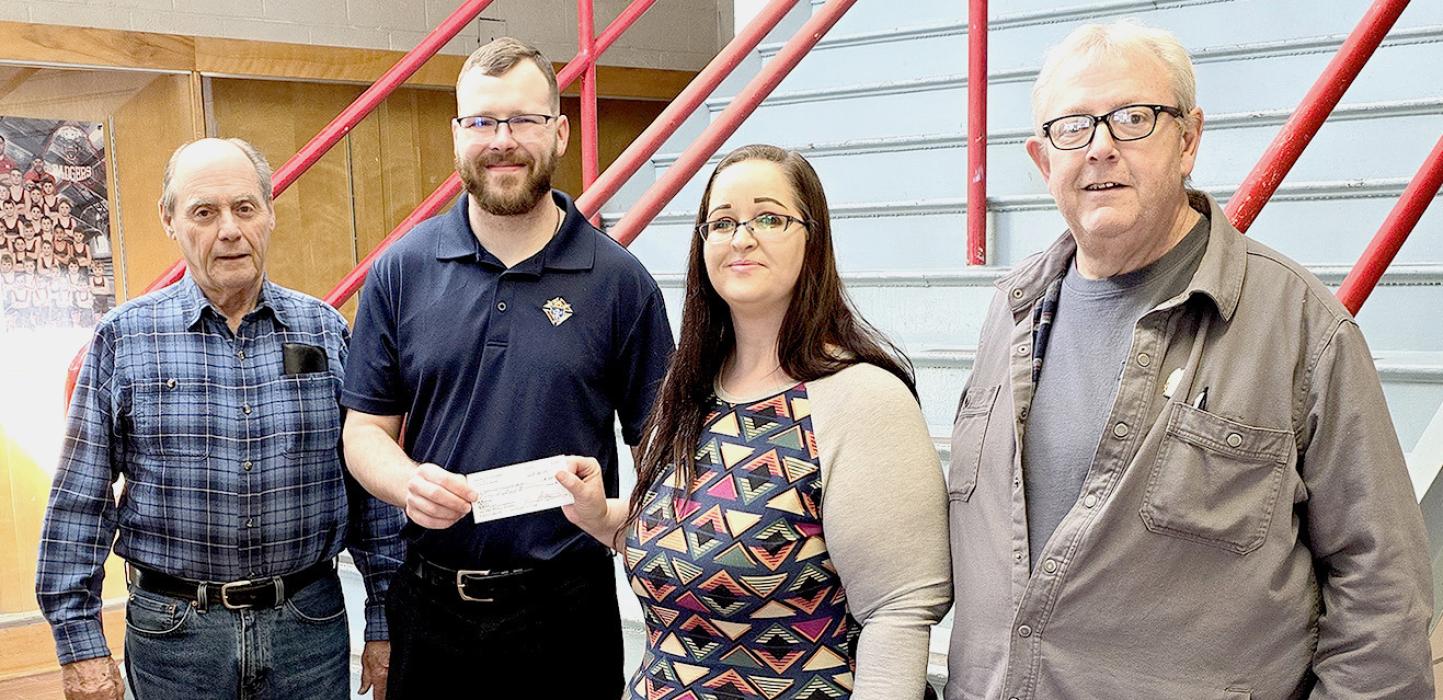 Erica Chipperfield, service navigator, Alliance Office at North West Community Action was a recipient of Knights of Columbus funds and are pictured from L to R: Fourth Degree Knight Glenn Clasen, Grand Knight Justin Hartman, Erica Chipperfield, and Financial Secretary Steve Grey.