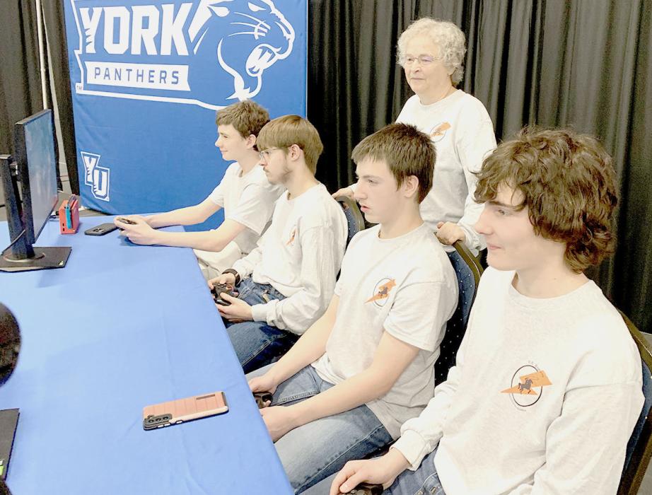 The Cody-Kilgore eSports team was playing for the Championship at York College. They are pictured from L to R: Logan Hendrix, Justin Wyckoff, Tripp Hill and Mason Jones. Emiliano Garza was the designated sub. Coach Richie provided the team with current placings during the game.