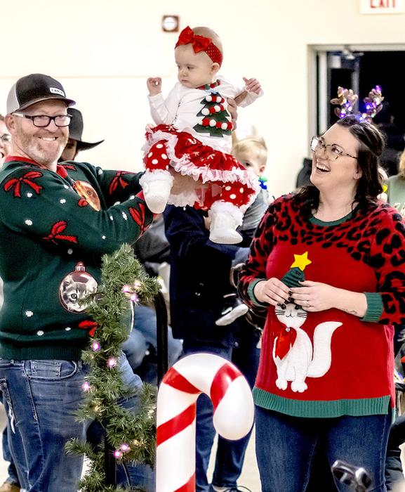 The festive Rhea family wearing their Christmas sweaters!