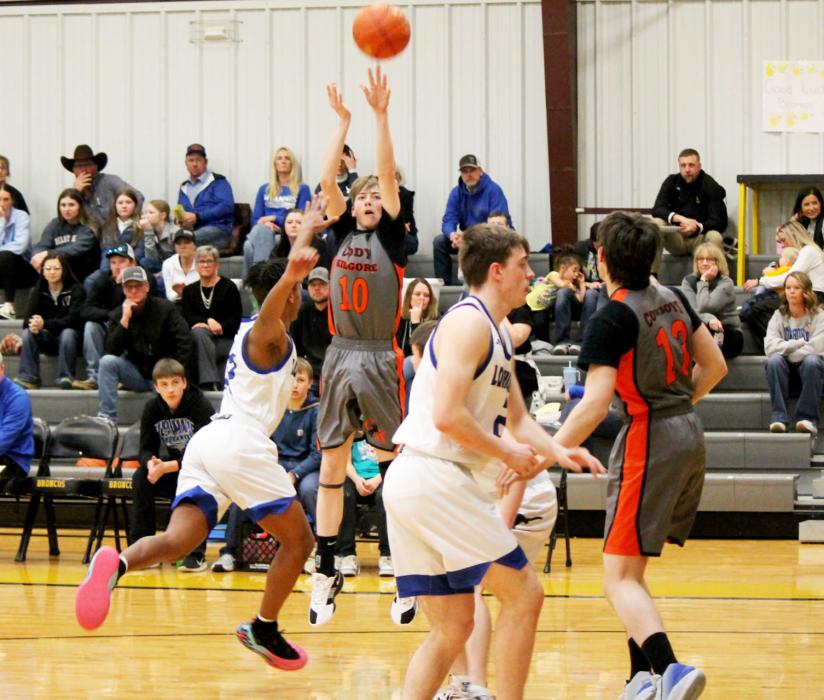 CK sophomore Luke Cooper (10) takes a contested shot in basketball action during the subdistrict semi-final vs. Hyannis. Photo by CK senior Kynzee McConaughey