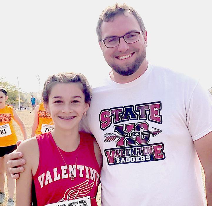 Coach Alex Jensen and junior high runner Kealy Titus in fourth place with 12:37.