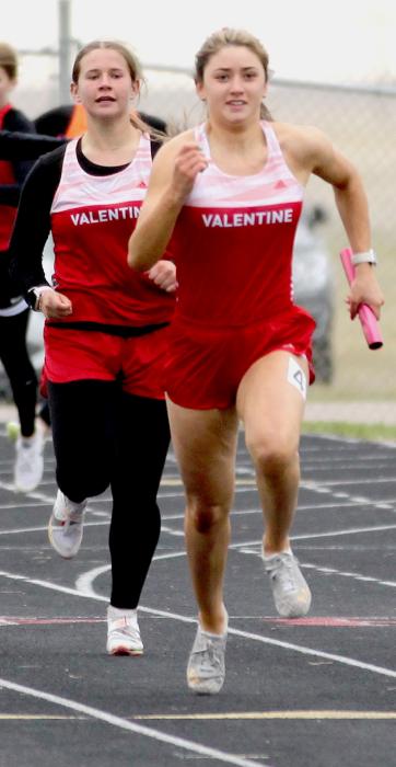 Kimber McGinley passes to Alivia Patterson in the 4x100 Meter Relay.