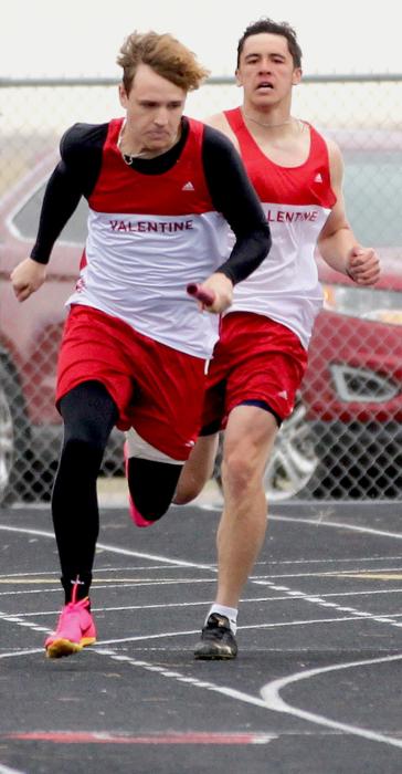 Andon Olson passes the baton to Lex Larsen in the 4x100 Meter Relay.