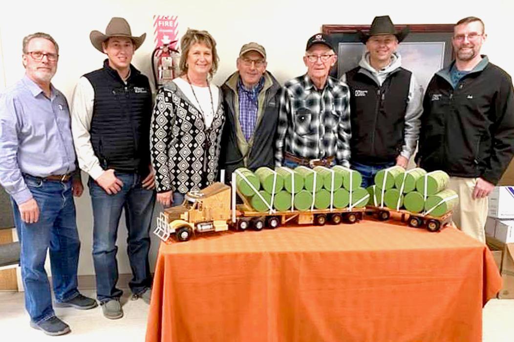 Pictured are members from Security First Bank and Valentine Livestock who were the winning bidders on Swede Lolley’s hand crafted wood hay hauler, L to R: Steve Brown, Trent Solida, Lisa Bellin, Greg Arendt, Swede Lolley, Tom Cooper, and Josh Krueger.