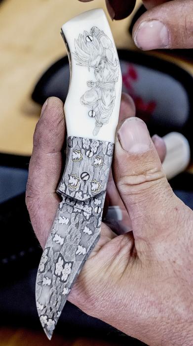 This intricately designed knife includes scrimshaw on the handle, gold inlay, and images from a childhood favorite Dragon Ball. Photos by Laura Vroman
