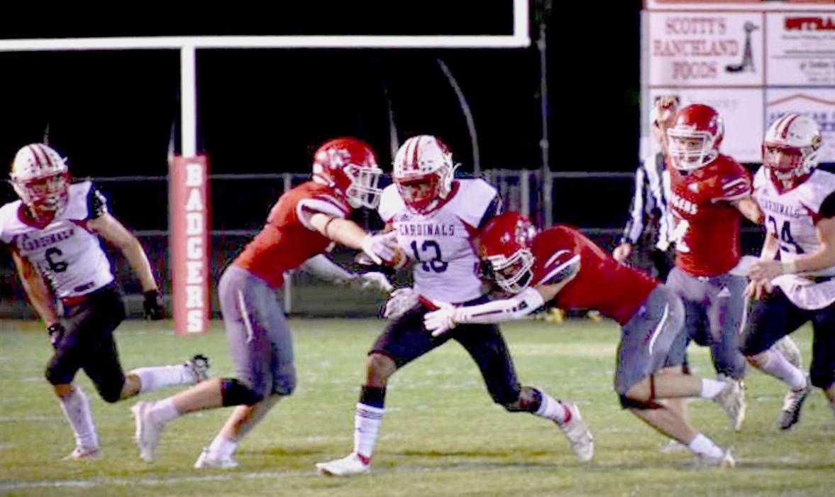The Badgers are going for the Cardinal’s ball carrier in the game held at home, Friday, September 16, 2022. Photos by DeanNa Fowler