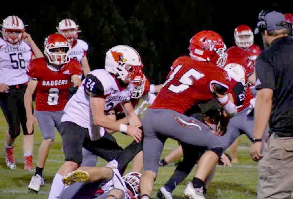 Cayden Lamb #15 attempts a tackle on Chadron.