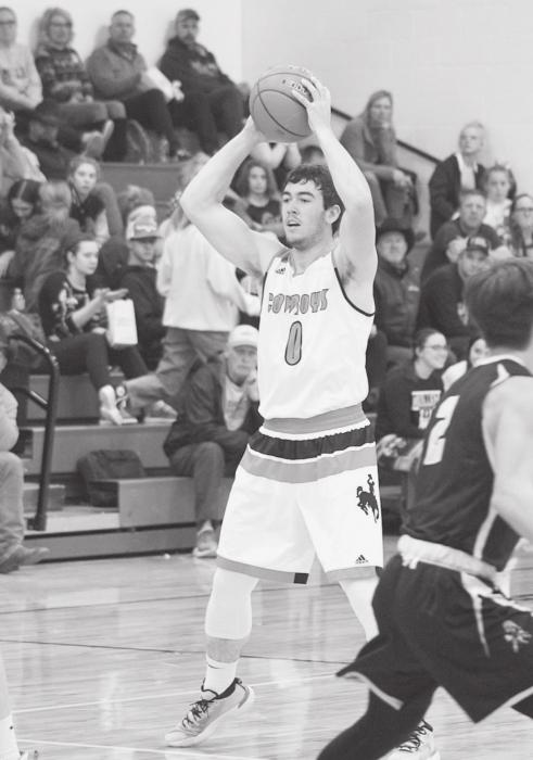 Gage Davis #0 is looking for a teammate to pass the ball to. Photo by Shontell Roseberry