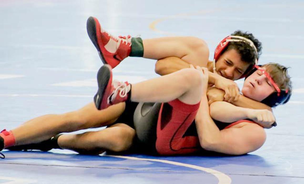 Junior Jekhi Williams tries to keep his opponent in a cradle during the first day of competition at the Norm Manstedt Tournament. Jekhi ended the tournament with a third place finish. Photos by Karen Phillips