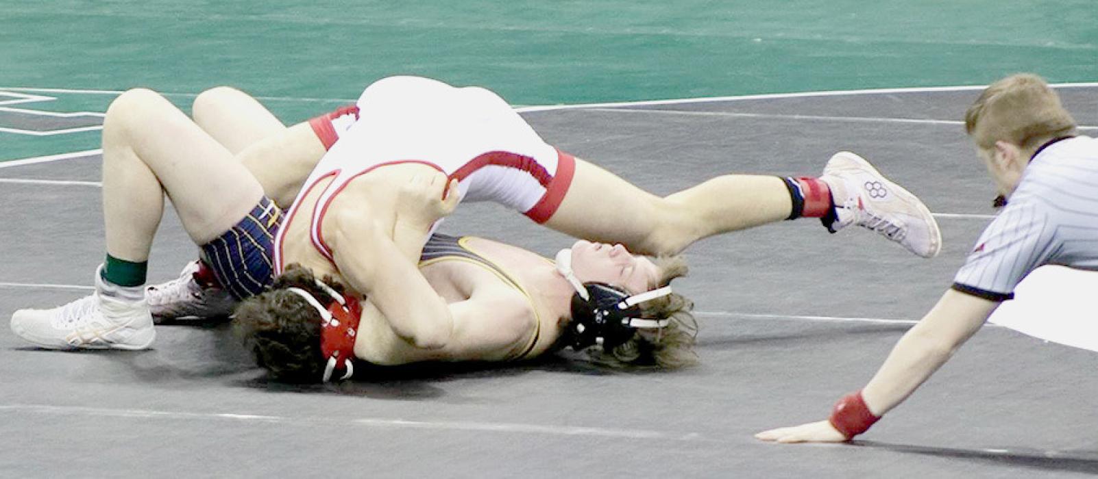 Cayden Lamb wrestled at 170# and earned first place at NSAA State! “Cayden Lamb won his state title in dominant fashion. Cayden had three pins and a tech fall en route to his title, and will go down as one of the most dominant performances ever at the state tournament,” said Coach Shane Allison. Photos by Jessica Stankoski