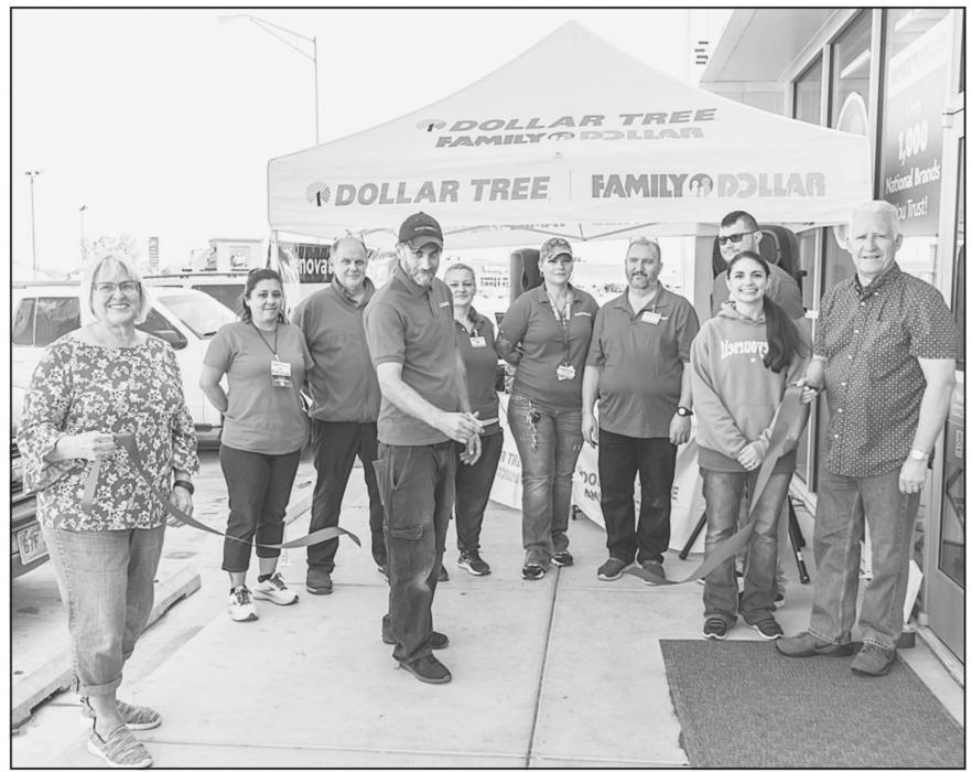 The Family Dollar team is flanked by Chamber members Nadeane Allard, Ann Krueger, and Chamber Director Dean Jacobs. Photo by Laura Vroman