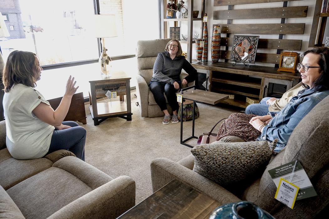 The partners visited with several downtown businesses including Nelsen Furniture where Annie Bailey shared with Rachel Morgan, and Dahn Hagge the beginnings of the business that she and her husband, Sam, now own.