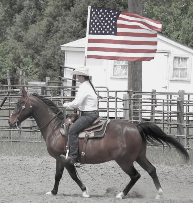 Meghan Peterson rides into the arena at the introduction of the Circle C Rodeo. Photo by Joslyn Nollette