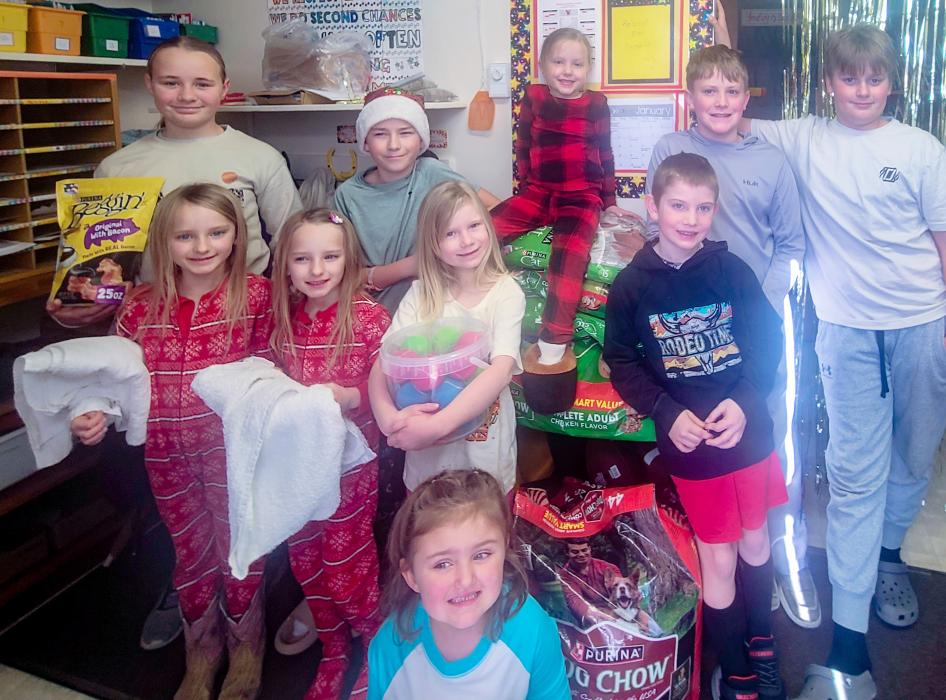 Simeon School chose the pet shelter and Cherry Hills for their service projects this year. Students made cards for each resident at Cherry Hills to brighten their holidays. Close to 200 pounds of cat and dog food, as well as some treats, toys, and bedding were collected and will be donated to help the animals at the shelter.