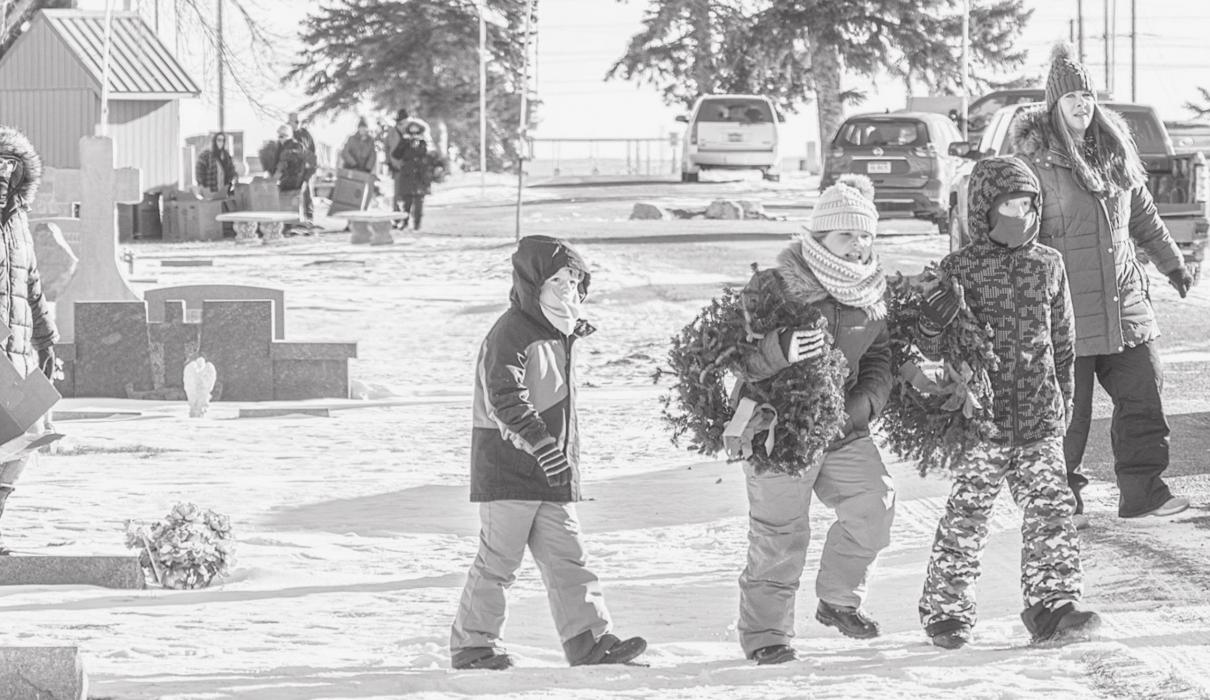 Many civic organizations came out Saturday, December 18, to lay the wreaths on that very cold day. Although many said the sun was shining, or the weather could have been worse. So true. Wreaths will need to be removed before the first mowing of spring. Families, friends, and volunteers are welcome to help when that time is announced. Photo by Laura Vroman