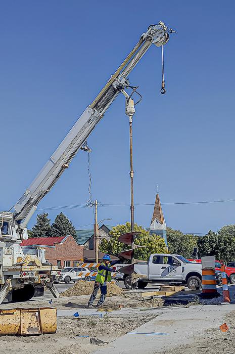 IES prepares a giant drill that will hold Valentine’s new traffic signals. Photo by Laura Vroman