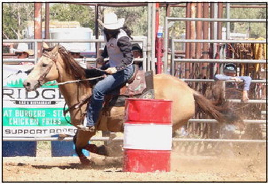Elle Ravenscroft and her horse Buckwheat running the barrels. They finished sixth among 91 entries in the event. Her times were 17.84 and 17.94 seconds.