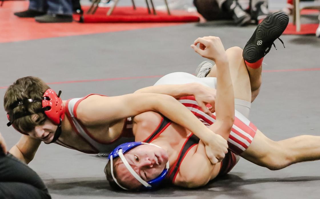Rownan Eggert is working to keep his opponent down on the mat. Photos by Karen Phillips