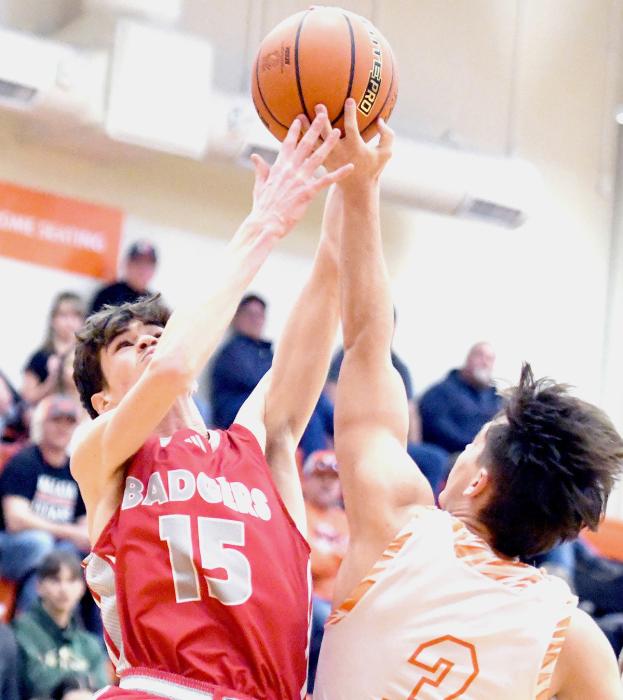 Above, Isaac Cronin tries to gain control of the ball against the Indians. Below, John Gibson is ready to make a play. Photos by Harry Lipsiea, Keith County News