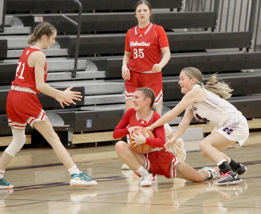 Vying for control of the ball, the Lady Badgers work together.