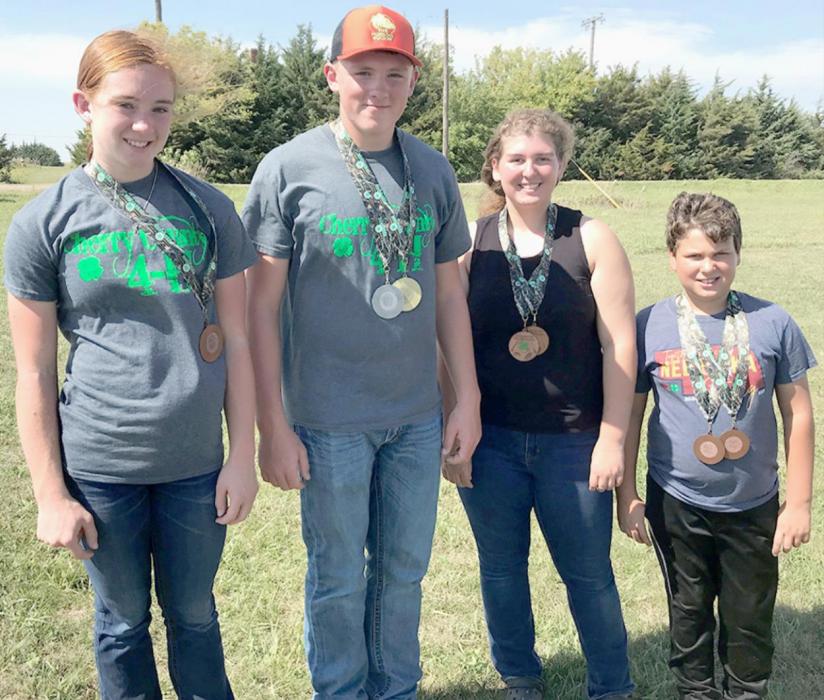 State 4-H Outdoor Archery Medal Winners are pictured from L to R: Ayden Naslund, Dylan Naslund, Jenalee Garwood, and Jaeden Garwood.