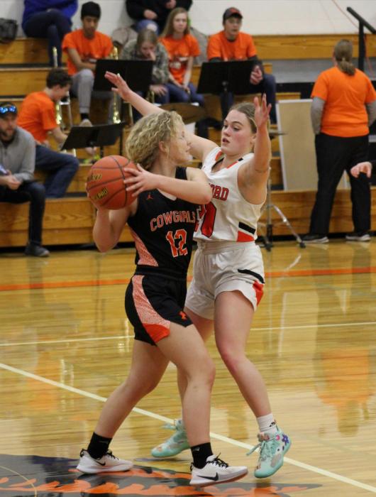 Colby Cady moves the ball away from her defender in the game against Crawford. Photo by Shontell Roseberry