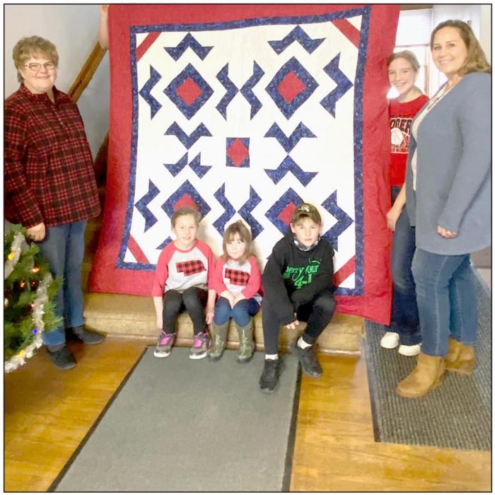 Julie Foster was the winner of the Quilt of Valor raffle. The quilt was created by 4-H members Ruby Shelbourn, Cadence Swanson, Kate Cox, and Rylee Wackler with the help of Leader, Rhonda Cherry.