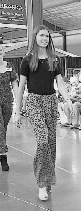 Kate Cox received purple ribbons for her STEAM Level 2 outfit at the Fashion Show.