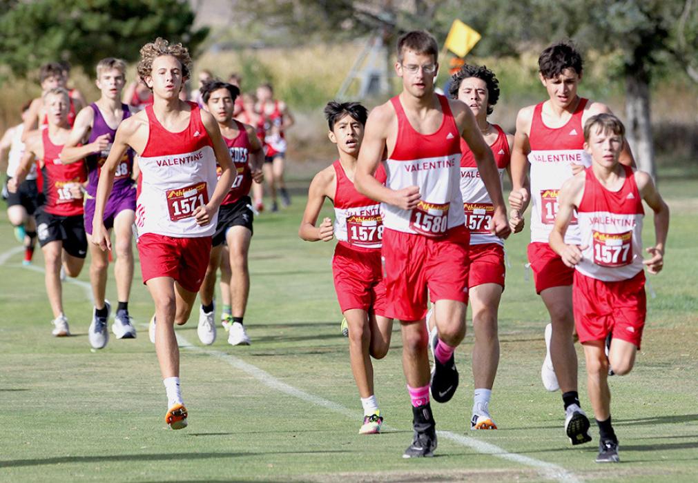 Above right, a pack of Badgers including Jon Gibson, Tanner Two Strike, Andon Olson, Cayden Stankoski, Devlin Welch, and Deklin Titus; the men’s 5000 meter varsity placed fifth at Southwest Conference.