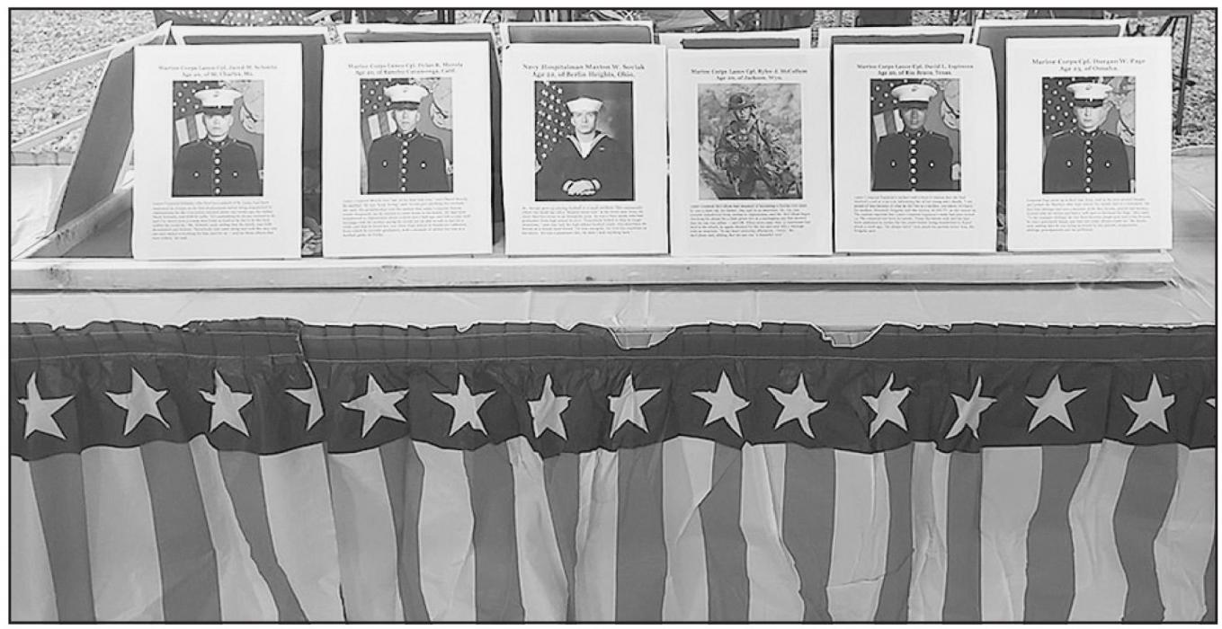 A tribute table set up at the fast draw competition to honor 13 soldiers recently killed in Afghanistan.