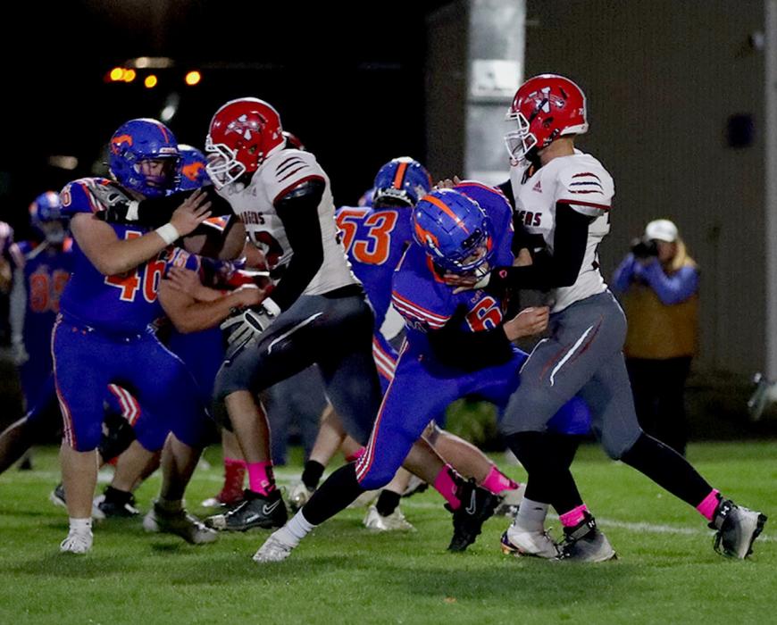 Seniors Thane Taylor #72 and Quinton Nelson #75 blocking the Mustangs.