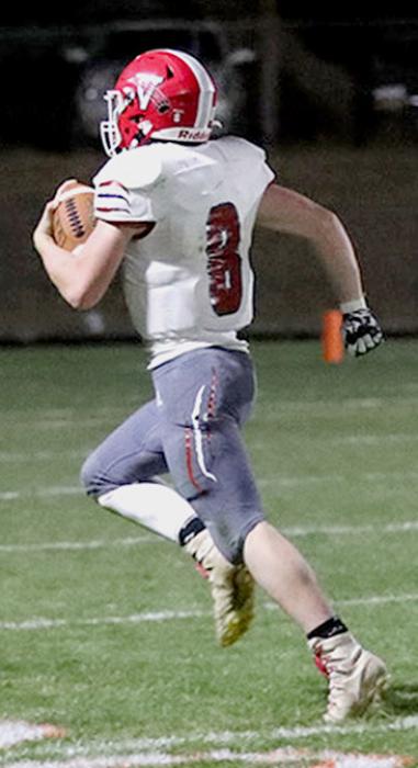 Parker Chavez #8 on a 50 yard touch down run. Photos by Nina Maria Nelson