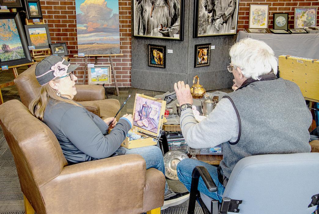 Sand Painter Joan Swim has been painting a still life that speaks something heartfelt and sweet inside Sandhills State Bank.