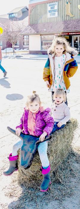 These three siblings are practicing the finer art of bull riding!! Pictured are from front to back: Hannah, Abel and Vivian. They are the children of Claire and Thomas Carr.