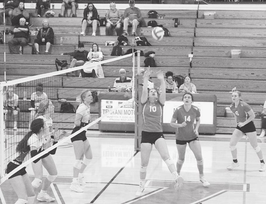 Kinsey Buechle is setting the ball in the game against Chadron.