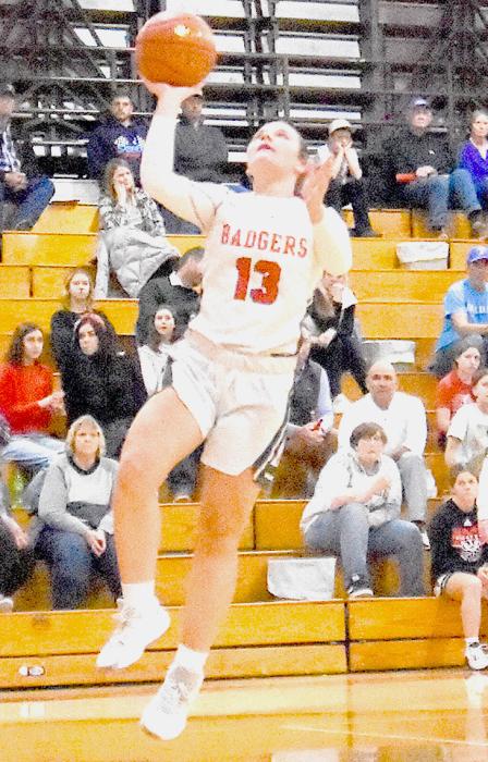 Jayda From #13 prepares to make a basket in the game against North Central Knights. The Lady Badgers won with a score of 34-30. Scoring by quarters: Valentine - 7, 6, 9, 12 = 43 North Central - 7, 8, 9, 6 = 30 Photo by Kris Larsen