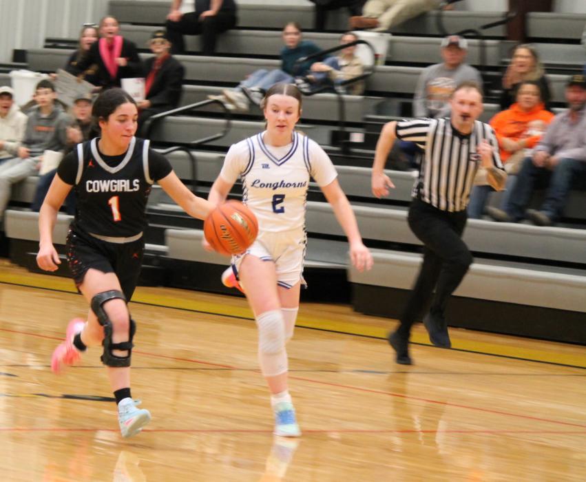 CK sophomore J.J. Sterkel on a fastbreak after stealing the ball from Hyannis's Bailee Leonard during first round action for the D2-12 subdistrict basketball tournament. Photo by CKBeat Kynzee McConaughey