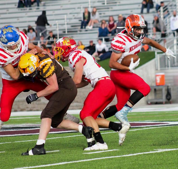 Peyton Sterkel #2 carries the ball as he breaks from the line of scrimmage. Photos by Shontell Roseberry