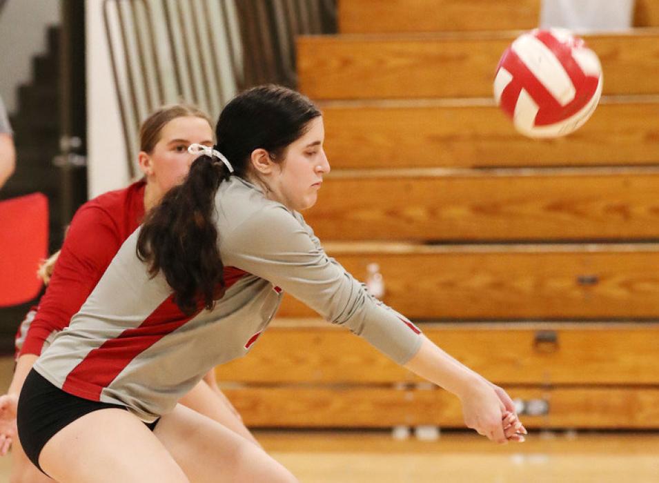 Above, Libero Dankia Janssen #4 down for a dig. At left, Senior Ashlyn Hutchinson #7 passing the ball. Photos by Nina Maria Nelson