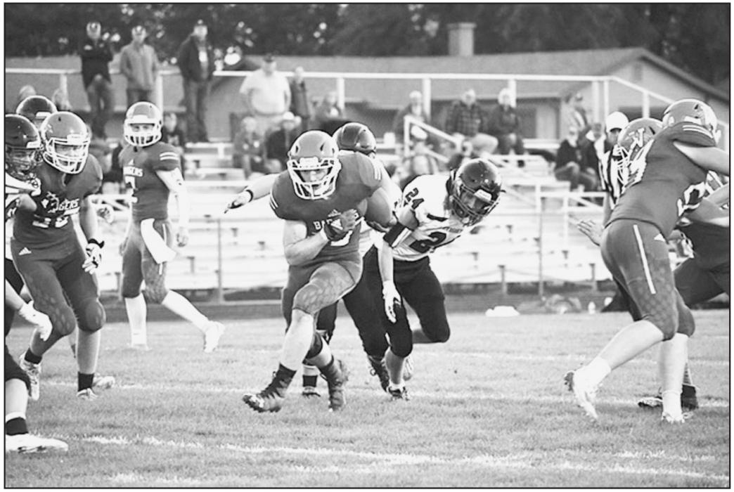 Gunnar Battershaw makes a break through the line of scrimmage and carries the ball down field. Photos by DeanNa Fowler