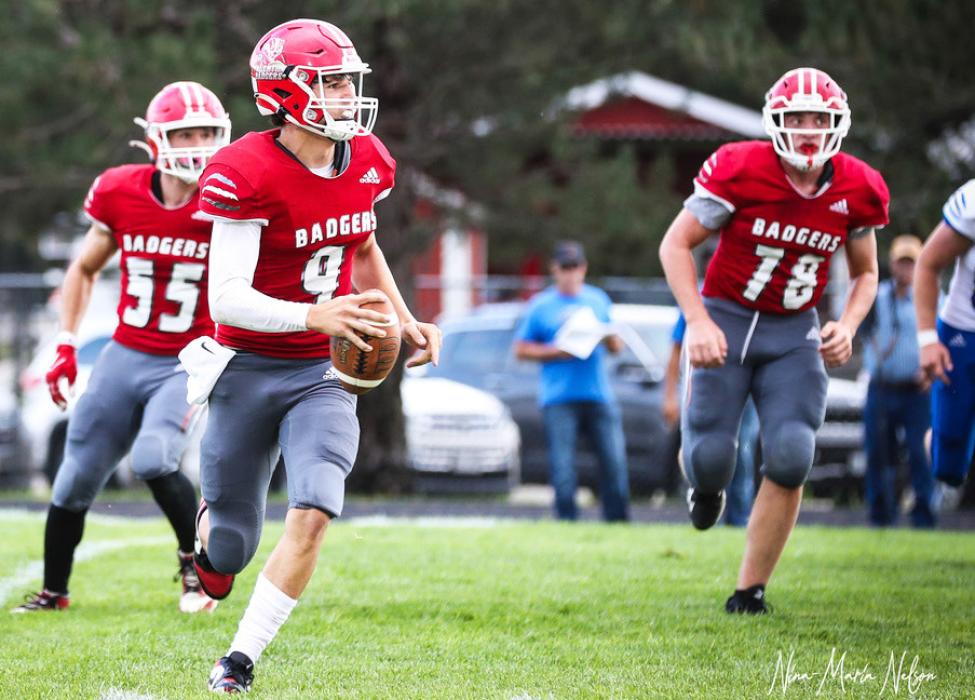 QB Trace Buechle is looking for a Badger to make a pass.