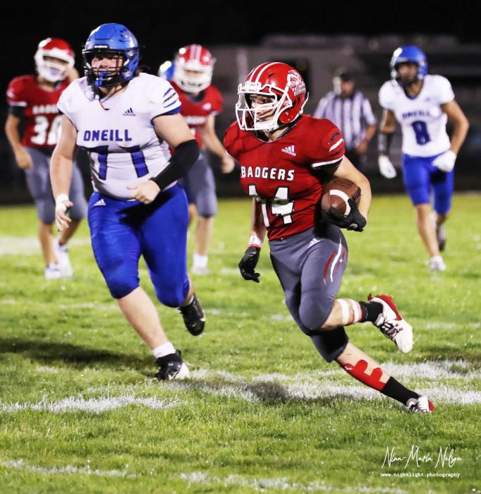 Lane Shelbourn #14 runs the ball to a touchdown. Photos by Nina-Maria Nelson