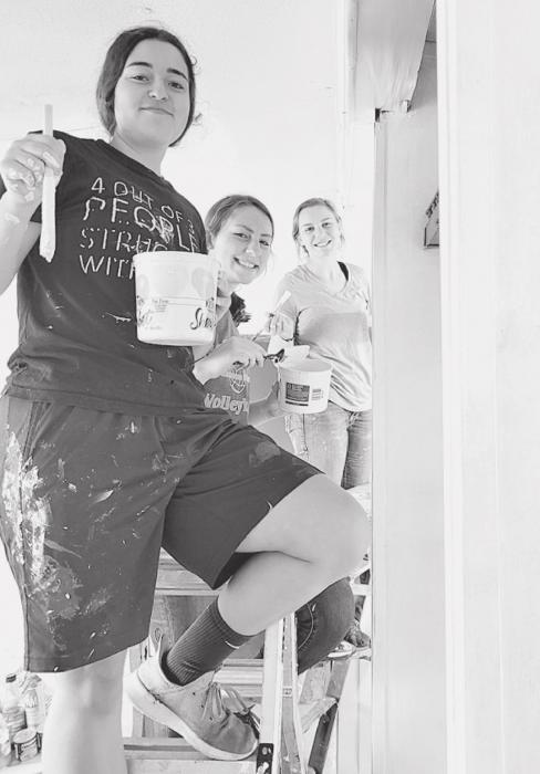 Abby Busenitz of Nenzel, is busy painting the warehouse with a new coat of Light, so to speak!