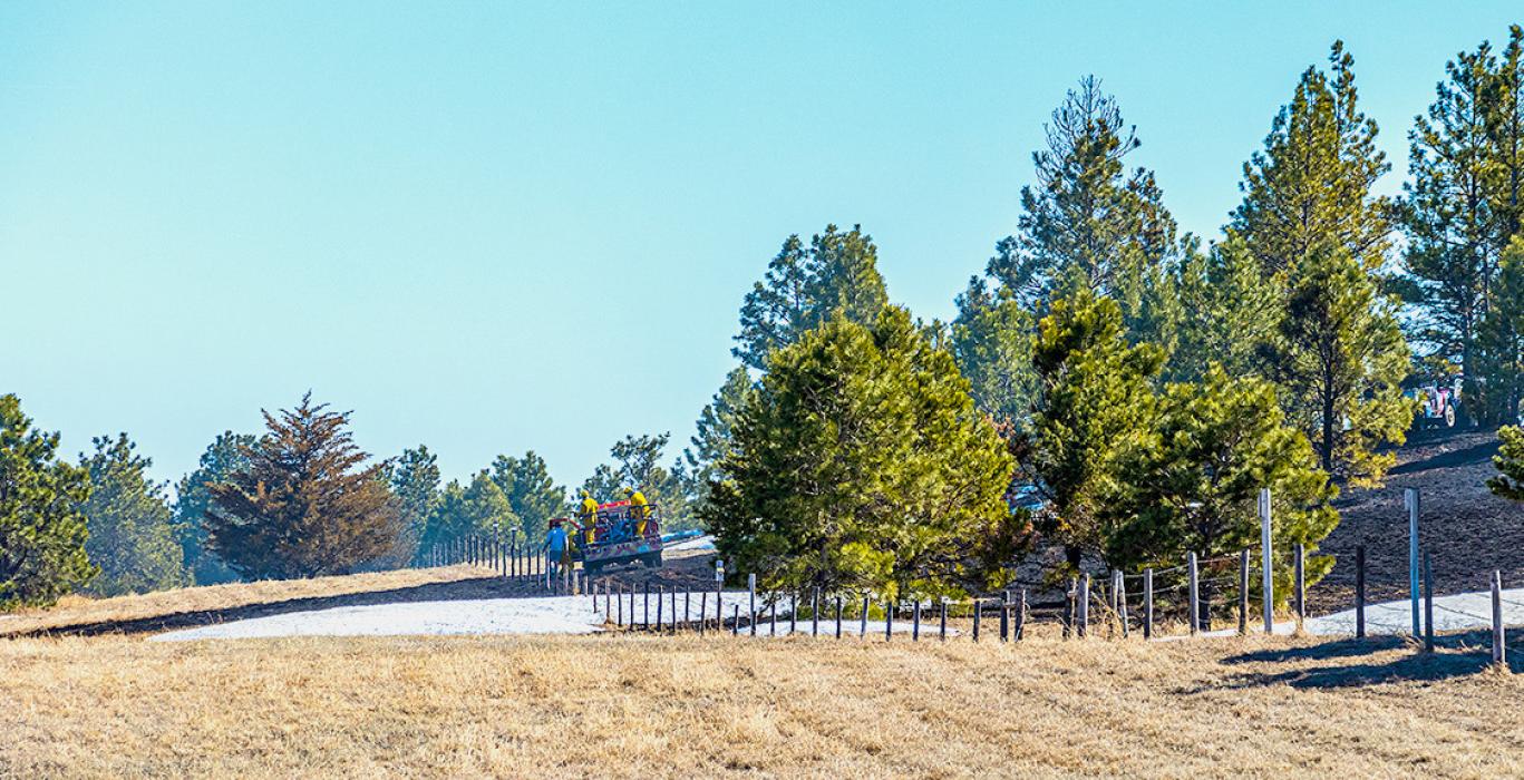 Although snow is still on the ground in places, the brown grass burned a couple acres in the warmth and low humidity Friday, April 7. Photos by Laura Vroman