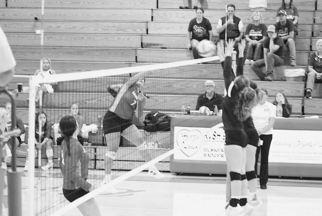 Malika Monroe is hitting the ball to Stuart during the Lady Badgers Triangular.
