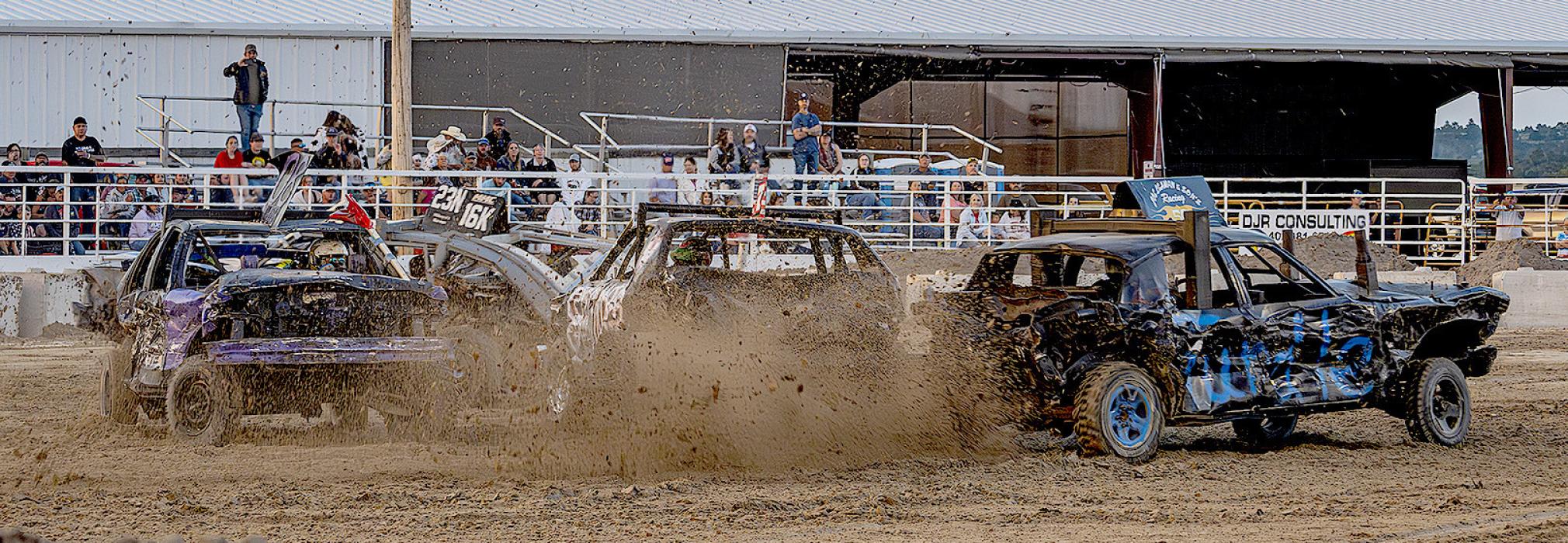 The last go at the derby resulted in all the vehicles stuck together which had to be undone by tractors; then it was go time again! Photo by Laura Vroman