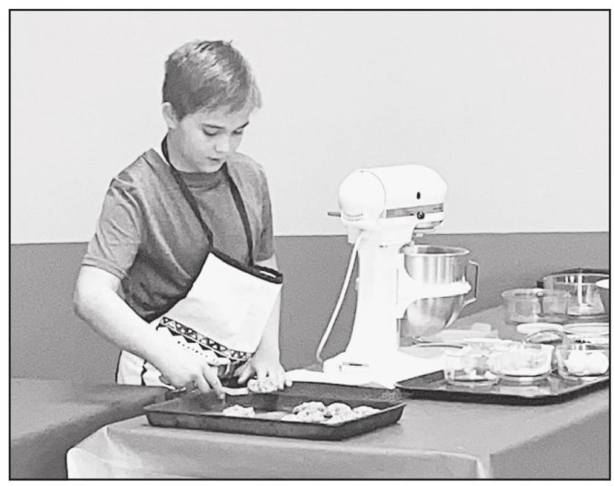 Will Cox presenting about baking cookies.